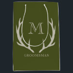 Rustic Army Green Antler Custom Groomsmen Gift Medium Gift Bag<br><div class="desc">Elevate your groomsmen gifts with our exquisite Gift Bag, an ideal token for proposing to your groomsmen or honoring your best man. Crafted with a fusion of rustic charm and contemporary style, this bag features an army green design complemented by soft amber/beige antler motifs and personalized monogram initials. Embrace the...</div>