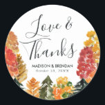 Rustic Autumn Forest Fall Wedding Classic Round Sticker<br><div class="desc">Add a personalized touch to your favor bags with our Rustic Autumn Forest wedding stickers. The personalized wedding stickers feature the phrase "Love & Thanks" in an elegant calligraphy font, your names, and wedding date framed by a border watercolor trees in shades of yellow, orange, burgundy, rust, and green. Designed...</div>