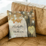 Rustic Autumn Tree Monogram Newlywed Couple Throw Pillow<br><div class="desc">Autumn woodland newlywed pillow featuring a rustic fall tree covered in red, orange and yellow leaves, a carved heart with their initials, string twinkle lights and a modern text template. For further customization, please click the "Personalize it" button to modify this template. All text style, colors, and sizes can be...</div>