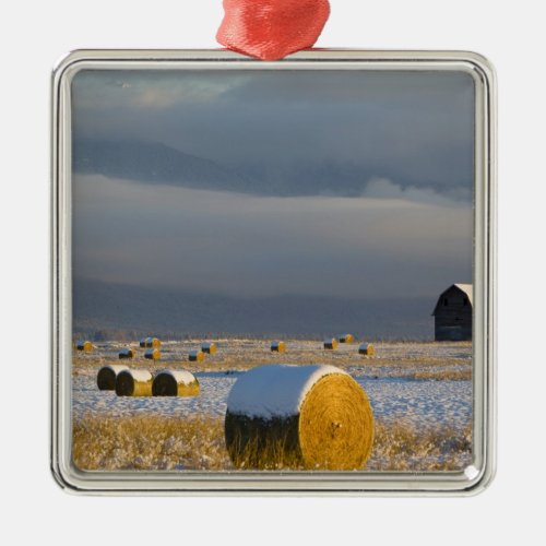 Rustic barn and hay bales after a fresh snow 3 metal ornament