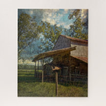Rustic Barn Surrounded by fields under a Blue Sky.