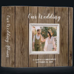 Rustic Barn Wood Calligraphy Photo Wedding Album 3 Ring Binder<br><div class="desc">Rustic or country wedding theme design featuring a square photo in a white shabby chic frame on a brown barn wood background. The words "Our Wedding" appear in modern white calligraphy style script on the cover, with the bride and groom's names and wedding date below in a smaller sans serif...</div>