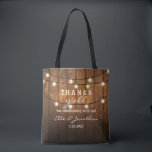 Rustic Barn Wood Country Wedding Thanks Y'All Tote Bag<br><div class="desc">Thank your out of town wedding guests with this personalized tote bag featuring a rustic design with twinkle string lights set against a barn wood background. Fun text reads "Thanks y'all" for celebrating with us! Personalize with 5 lines of custom text. Use as a thank you bag for bridesmaids, groomsmen,...</div>