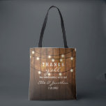 Rustic Barn Wood Country Wedding Thanks Y'All Tote Bag<br><div class="desc">Thank your out of town wedding guests with this personalized tote bag featuring a rustic design with twinkle string lights set against a barn wood background. Fun text reads "Thanks y'all" for celebrating with us! Personalize with 5 lines of custom text. Use as a thank you bag for bridesmaids, groomsmen,...</div>