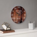 Rustic barn wood family name country large clock<br><div class="desc">Rustic, dark barn wood wall clock with large Roman numbers.
You can personalize and add your own name and year established.</div>