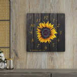 Rustic barn wood sunflower family farmhouse square wall clock<br><div class="desc">Rustic country style wall clock with a yellow gold sunflower over a dark brown barn wood background.               Personalize it with your family name and text!             It can be a beautiful keepsake gift for your family anniversary,  wedding,  couple shower,  housewarming.</div>