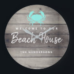 Rustic Beach House Coastal Personalized Large Clock<br><div class="desc">Set off your nautical home decor with this Rustic Beach House Coastal Personalized Large Clock. This wooden shiplap design has a teal crab on the upper area and the phrase "welcome to our beach house" in white trendy calligraphy brushed script lettering. Your personalized family last name is on the lower...</div>