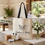Rustic Branches Wedding Monogram Tote Bag<br><div class="desc">Custom printed tote bags make a fun and functional wedding favor your guests will love! Personalize the template with the bride and groom's names or monogram initials. Add your wedding date, the city, state or venue name or any other custom text. This modern rustic logo-style design features mixed typography. Use...</div>