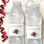 Rustic Burgundy Red & Blush Pink Roses Wedding Water Bottle Label<br><div class="desc">These water bottle labels will make your wedding celebration all the more special. They feature a design that is simple yet elegant with a cluster of watercolor roses in shades of burgundy, red, and blush pink. There is script lettering for the wedding couple's names and a place to enter the...</div>