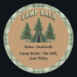 Rustic Camp Bach Plaid, Evergreen Tent Custom Text Classic Round Sticker<br><div class="desc">If your bachelorette crew is swapping city lights for campfire nights, this rustic kraft‑texture Camp Bach sticker is your weekend vibe in one perfect circle. A cozy green and beige plaid border wraps around a warm kraft‑style brown background, giving it that earthy, outdoorsy feel that’s right at home in the...</div>