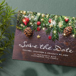 Rustic Christmas Wedding Save the Date Announcement Postcard<br><div class="desc">Rustic country save the date wedding postcards featuring a dark wooden background,  festive christmas tree branches,  red & gold tree decorations,  string twinkle lights,  and a text template that is easy to personalize.</div>