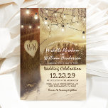 Rustic Christmas Winter Wedding Invitation<br><div class="desc">Discover the magic of winter and Christmas fused into one through our enchanting woodland wedding invitations. With a picturesque backdrop of snow-capped trees, twinkling string lights, and a heart carved with your initials, these invites are sure to set the perfect festive tone for your big day. The modern text template...</div>