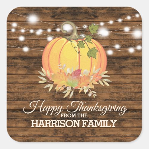 Rustic Country Personalized Happy Thanksgiving Square Sticker - Pretty, modern Thanksgiving greeting featuring a rustic wooden background, with a string of sparkling white lights, watercolor pumpkin and autumn leaves.