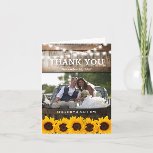 Rustic Country Thank You | Sunflower Wedding - SUNFLOWER VINEYARD WEDDING THANK YOU CARD | Country barn oak barrel background, a photo of the married couple, twinkle string lights, golden sunflowers, and your wedding details. Find other thank you cards at http://www.zazzle.com/special_stationery* Click on the “Customize it” button for further personalization of this template. You will be able to modify all text, including the style, colors, and sizes. You will find matching items further down the page, if however you can't find what you looking for please contact me.