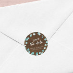 Rustic Eucalyptus and Brown Wood Save the Date Classic Round Sticker<br><div class="desc">This rustic wedding sticker features eucalyptus leaves with the words "save the date" in trendy script all against a brown wood background. Personalize it by replacing the placeholder text in the template to add your information. For more options such as to change the font and it's size/color or the spacing...</div>