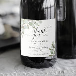 Rustic Eucalyptus Greenery Wedding Thank You Sparkling Wine Label<br><div class="desc">These sparkling wine bottle labels are perfect for thanking special guests, family, or members of your bridal party. They feature a rustic bohemian chic design with hand painted sprigs of eucalyptus leaves and foliage in shades of sage, mint, and moss green. There is elegant script calligraphy reading: Thank you for...</div>