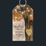 Rustic Fall Autumn Tree Wedding Favor Thank You Gift Tags<br><div class="desc">Autumn woodland wedding favor gift tags featuring a rustic fall tree covered in red, orange and yellow leaves, a carved heart with your initials, string twinkle lights and a modern wedding thank you template. For further personalization, please click the "Customize it" button to modify this template. All text style, colors,...</div>