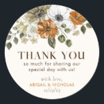 Rustic Fall Flowers Wedding Thank You Welcome bag Classic Round Sticker<br><div class="desc">Beautiful "Thank You" favor sticker featuring watercolor creme,  rust,  burnt orange flowers,  and fall foliage. This modern floral design is perfect for creating autumn-themed stationery! Make it your own with ease by plugging in your info. An elegant gift bag sticker template to make the occasion so much more special.</div>