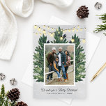 Rustic Family Photo Christmas Tree Farm Holiday Card<br><div class="desc">This festive "We wish you a Merry Christmas!" holiday photo card design features a rustic chic winter scene from a Christmas tree farm that frames a favorite family portrait. Includes a snowy gray background with hanging string twinkle lights and fresh-cut green watercolor pine trees. Personalize with your choice of greeting,...</div>