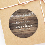 Rustic Farmhouse Wedding Thank You Classic Round Sticker<br><div class="desc">Capture the rustic charm of your wedding day with our Rustic Farmhouse Wedding Thank You Sticker. These enchanting stickers are the perfect finishing touch to express your gratitude to loved ones who shared in your special day. Designed with meticulous attention to detail, these stickers feature rustic-inspired elements like distressed wood...</div>