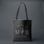 Rustic Floral Stem Wedding Monogram | Black Tote Bag<br><div class="desc">Custom printed tote bags make a fun and functional wedding favor your guests will love! Personalize the template with the bride and groom's names or monogram initials. Add your wedding date, the city, state or venue name or any other custom text. This modern rustic logo-style design has a simple floral...</div>