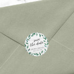 Rustic Greenery Save the Date Classic Round Sticker<br><div class="desc">This rustic Save the Date sticker featuring Italian Ruscus with the words "save the date" in trendy script all against a pale wood background. Personalize this by replacing the placeholder text in the template to add your information. For more options such as to change the font and it's size/color or...</div>