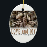 Rustic Holiday Love and Joy Pine Cone Ceramic Ornament<br><div class="desc">Festive,  rustic pine cones accentuate this classic,  elegant design wishing holiday Love and Joy.</div>