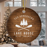 Rustic Lake House Boat Oars Trees Wood Print Ceramic Ornament<br><div class="desc">A beautiful, rustic themed ceramic ornament, featuring your family name and "Lake House" or other desired text along with its established date and location. This custom, unique design features a white silhouette of crossed boat oars and pine trees on a rich colored print of wood planks. A charming addition to...</div>