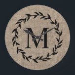 Rustic Laurel Wreath Family Monogram Farmhouse Large Clock<br><div class="desc">Rustic Burlap Country Family Monogram Farmhouse Large Clock features your family's initial inside a laurel wreath. The background is burlap. What a great way to add a touch of country, farmhouse to your kitchen or any room! Clock is part of a collection. If you need any assistance personalizing your shower...</div>