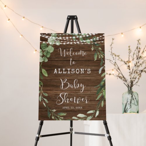 Rustic lights greenery baby shower welcome sign
