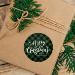 Rustic Merry Christmas Script Green Plaid Classic Round Sticker<br><div class="desc">Rustic holiday stickers featuring "Merry Christmas" displayed in a handwritten white script with a green plaid background. Personalize the plaid Christmas stickers with your name or custom text. Use the rustic Christmas stickers to seal envelopes,  holiday gifts,  and holiday party favors.</div>