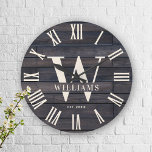 Rustic Monogram Farmhouse Custom Family Name Large Clock<br><div class="desc">Personalized Family Name, monogram, and year established Rustic Modern Wall clock in a trendy farmhouse style design with roman numeral clock face and dark brown black wood plank / shiplap backdrop design. Perfect gift for newlyweds, wedding or housewarming present or grandparents gift, or for a home make-over in your cabin,...</div>