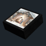 Rustic Nativity Scene with Winter Florals Gift Box<br><div class="desc">This serene nativity scene captures the peaceful beauty of the Holy Family beneath a rustic wooden stable, gently lit by lanterns and surrounded by soft snowfall. The design features Mary, Joseph, and baby Jesus in a warm, reverent moment, accentuated by delicate winter florals, snow-covered pine branches, and glowing string lights....</div>