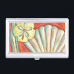 Rustic Orange Seashells Business Card Holder<br><div class="desc">Lay out on the warm sand and find the hidden treasures! This painting by Nancy Slocum captures the beautiful water life found ashore. It captures the a beautiful orange seashell,  an orange starfish,  and a vibrant blue sand dollar. Get your beautiful ocean art today on your next Zazzle product.</div>
