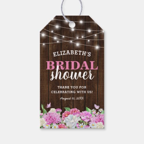 Rustic Pink Floral Bridal Shower Favor Gift Tags - Country chic bridal shower favor gift tags featuring a rustic wood background, backyard string lights, elegant pink and white garden flowers, and a bridal party thank you template that is easy to personalize.