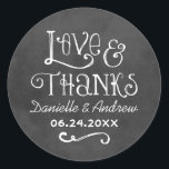 Rustic Script Love and Thanks Chalkboard Wedding Classic Round Sticker<br><div class="desc">Charming chalkboard favor stickers feature "Love & Thanks" with a custom wedding monogram in handwritten style fonts that have a white chalk appearance. Background has a rustic black board textured appearance.</div>
