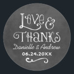 Rustic Script Love and Thanks Chalkboard Wedding Classic Round Sticker<br><div class="desc">Charming chalkboard favor stickers feature "Love & Thanks" with a custom wedding monogram in handwritten style fonts that have a white chalk appearance. Background has a rustic black board textured appearance.</div>