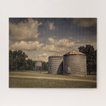 Rustic Silos in a Sleepy Scene Under Fluffy Clouds