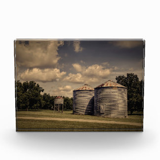 Rustic Silos in a Sleepy Scene Under Fluffy Clouds Photo Block