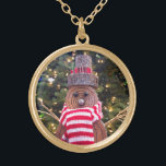 Rustic snowman red stripe scarf tree lights cute gold plated necklace<br><div class="desc">A close-up photo of a happy and cute, rustic log snowman, wrapped in a red and white striped scarf against lighted trees helps you usher in Christmas and New Year. Feel the warmth and joy of the holiday season whenever you wear this fun and unique photo charm necklace. This necklace...</div>