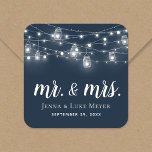 Rustic String Lights Mr. and Mrs. Wedding Monogram Square Sticker<br><div class="desc">Custom printed stickers personalized with your Mr. and Mrs. monogram and wedding date, perfect for wedding favor labels, welcome bags or envelope seals with your invitations. The design features glowing string lights and mason jars on a navy blue background. Use the design tools to choose any background color, change the...</div>