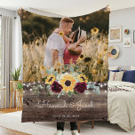 Rustic Sunflower Wedding Couple Photo Fleece Blanket<br><div class="desc">This rustic sunflower and burgundy roses country wedding couple photo blanket makes a perfect gift. This blanket features watercolor yellow sunflowers with burgundy roses and baby's breath and sage greenery on a wood background. This is a perfect color scheme for a late summer or fall wedding. Personalize with names and...</div>