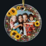 Rustic Sunflower Wreath Family Photo Christmas Ceramic Ornament<br><div class="desc">Create your own family photo Christmas ornaments using this easy to use ceramic ornament template. This unique and artistic watercolor design depicts a floral holiday wicker wreath decorated with cheerful sunflowers and burgundy red holly berries. The twisted wooden branches are accented with gold, luminous string lights and a tartan plaid...</div>