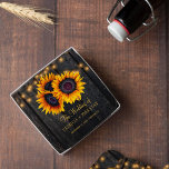 Rustic sunflowers barn wood lights wedding favor glass coaster<br><div class="desc">Rustic country vintage traditional style personalized drink coaster with big yellow gold sunflowers and strings of twinkle lights on a dark brown barn wood background and with elegant gold typography script.             Newlyweds gift or favor for summer or autumn fall | elegant rustic country | outdoor garden backyard themed weddings.</div>