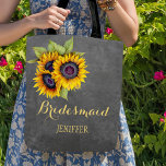 Rustic sunflowers chalkboard wedding bridesmaid tote bag<br><div class="desc">Rustic elegant fall wedding stylish bridesmaid / maid of honor / flower girl tote bag on dark gray chalkboard featuring beautiful yellow gold sunflowers bouquets . Personalize it with bridesmaid's name on front and with bride's and groom's names and wedding date on the back. ------- Fill in your information in...</div>