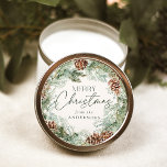 Rustic Watercolor Pine Cone Wreath Classic Round Sticker<br><div class="desc">Elegant holiday stickers featuring a watercolor wreath of pinecones,  pine boughs,  and lush greenery with a light cream background. "Merry Christmas" is displayed in a dark green script with your name shown below.</div>