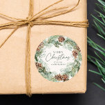 Rustic Watercolor Pine Cone Wreath Merry Christmas Classic Round Sticker<br><div class="desc">Elegant holiday stickers featuring a watercolor wreath of pine cones, pine boughs, and lush greenery with a light cream background. "Merry Christmas" is displayed in a dark green script with your name shown below. The rustic Christmas stickers are perfect to use for envelope seals, Christmas party favors, holiday crafts, and...</div>