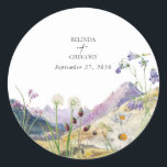 Rustic Watercolor Wildflower Mountain Wedding Classic Round Sticker<br><div class="desc">A beautiful watercolor wildflower and mountain wedding design. A unique design that uses watercolor wildflower botanicals and a watercolor mountain landscape in the background. A modern wild floral design with lakeside mountains and rivers. An elegant wedding sticker design with modern elements. Matching wedding invitations and other stationery items are also...</div>