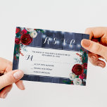 Rustic winter floral wedding elegant navy RSVP Enclosure Card<br><div class="desc">Rustic elegant burgundy and white peony roses wedding invitation response enclosure card on a dark navy blue barn wood background with strings of twinkle lights.           Matching stationery available in the suite.</div>
