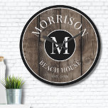 Rustic Wood Monogram Family Name Large Clock<br><div class="desc">This rustic clock is the perfect addition to your family beach house, lake house, game room, man cave, and more. It features a bold initial monogram at the center, with your family name elegantly displayed at the top. The bottom reads "Beach House, " but this can be customized to fit...</div>